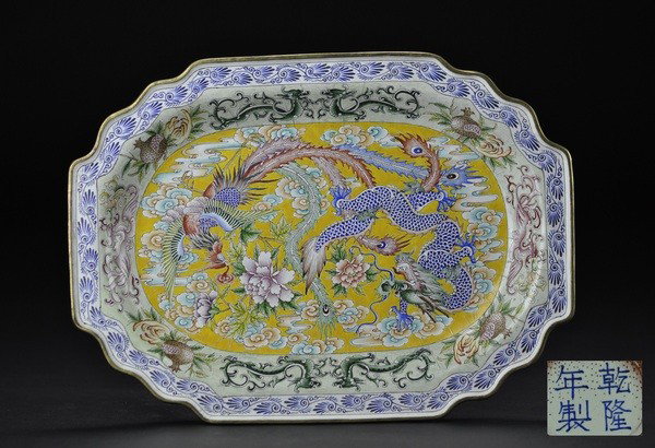 A CANTON ENAMELED PLATE.(QIANLONG MARK): - A CANTON ENAMELED PLATE.(QIANLONG MARK) finely painted with dragons,phoenix and flower ,bats in white -yellow ground,QIANLong mark on base.3x30cm.
