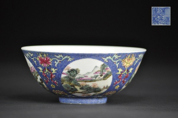 A FINE FAMILLE ROSE BLUE-GROUND BOWL .(MARK AND PE: Finely painted with four medallions filled with the landsape scenes, and separated by vertically positioned foliate sprays, all in famille rose enamels reserved on a blue ground incised with feathery 