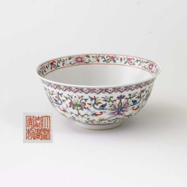 A FAMILLE-ROSE BOWL,MARK AND PERIOD OF JIAQING: the exterior decorated with lotus scroll and interior painted with bats and florals ,six character mark on base,2 3/4''H 6''Diam