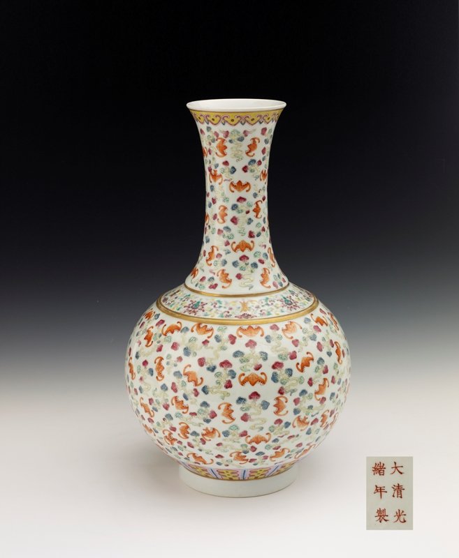 A famille-rose bottle vase, Mark and period of gua: Mark and period of guangxu The globular body colorfully enameled with a dense pattern of iron-red bats in flight amidst trailing multicolored clouds, between borders of stylized lappets around the bas
