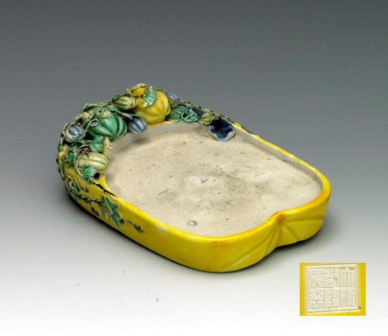 A famille-rose inkstone, Mark and period of Qianlo: Mark and period of Qianlong Decorated like an Asian melon. Marked seal. 4 3/4 inx 3 inx 1 1/8 in
