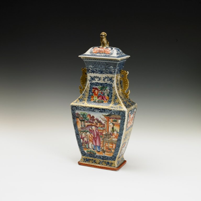 A export famille-rose vase and cover, Qianlong per: Qianlong period Of compressed baluster form, with molded lion finials and dragon handles, painted and gilt with floral roundels on grounds of scattered flower sprays 14 1/8 in