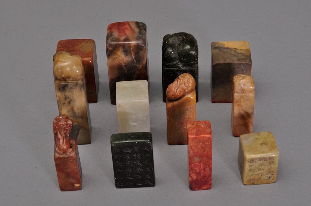 A SET OF TWELVE SOAPSTONE SEALS: 十二个寿山石印章 A set of twelve soapstones, all different color and sizes. 2 1/2 in. (6.3 cm) tall, 1 1/4 in. (3.1 cm) wide, 1 1/2 in. (3.8 cm) long. 2