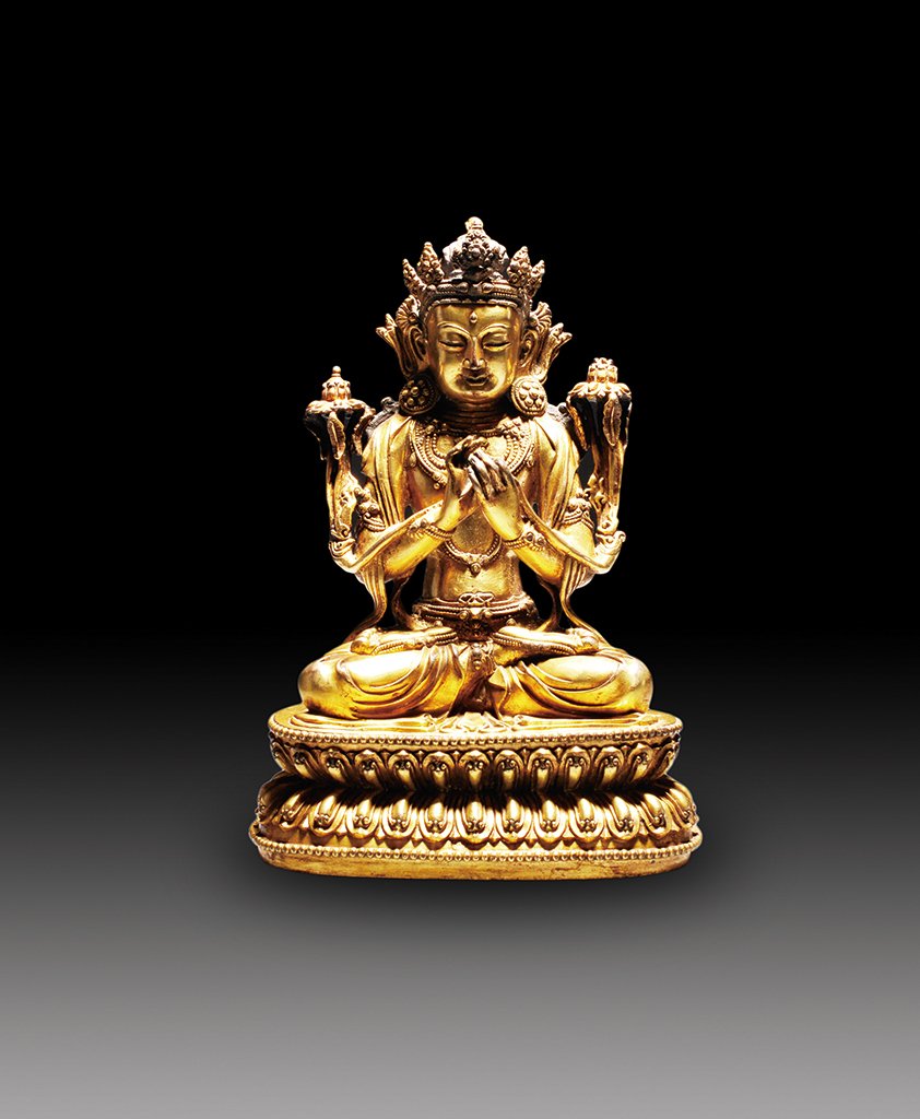 A GILT-BRONZE FIGURE OF BODHISATTVA: MARK OF YONGLE Seated in dhyanasana, the hands held before the chest in dharmachakra mudra, dressed in long flowing robes with delicately incised hems, the face with a gentle smile and downcast eyes,