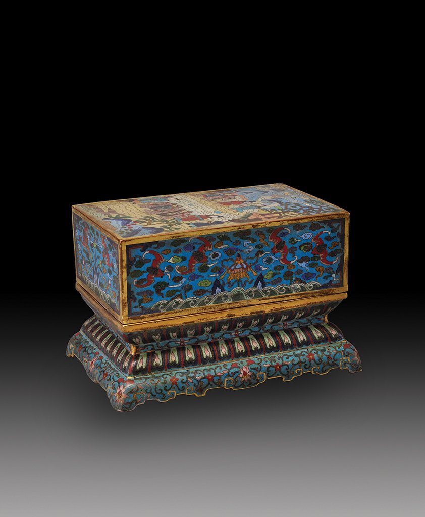 A GILT-BRONZE AND CLOISONNE ENAMEL BIBLE BOX AND COVER: QING DYNASTY The box and cover is of rectangular- shaped and is exteriorly decorated with numerous bats and flower sprays. 5 1/4 in. (13.3 cm) tall, 8 3/8 in. (21.3 cm) long, 5 9/16 in. (14.2 cm) wide