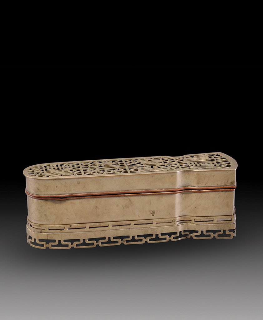 A WHITE COPPER BOX AND COVER: QING DYNASTY The box and cover is of rectangular- shaped and overall a white copper colour tone. 2 5/8 in. (6.7 cm) tall, 7 13/16 in. (19.9 cm) long, 2 7/16 (6.2 cm) wide.