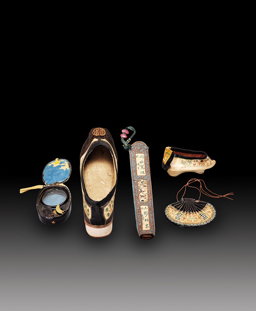 A SET OF FIVE SILK ITEMS: QING DYNASTY The five silk items consists of a make- up box, shoe, fan case, pouch bag and slipper. Big shoe: 10 in. (25.4 cm) long. Small shoe: 5 1/8 in. (11.8 cm) long. Fan holder: 16 1/2 in. (41.9