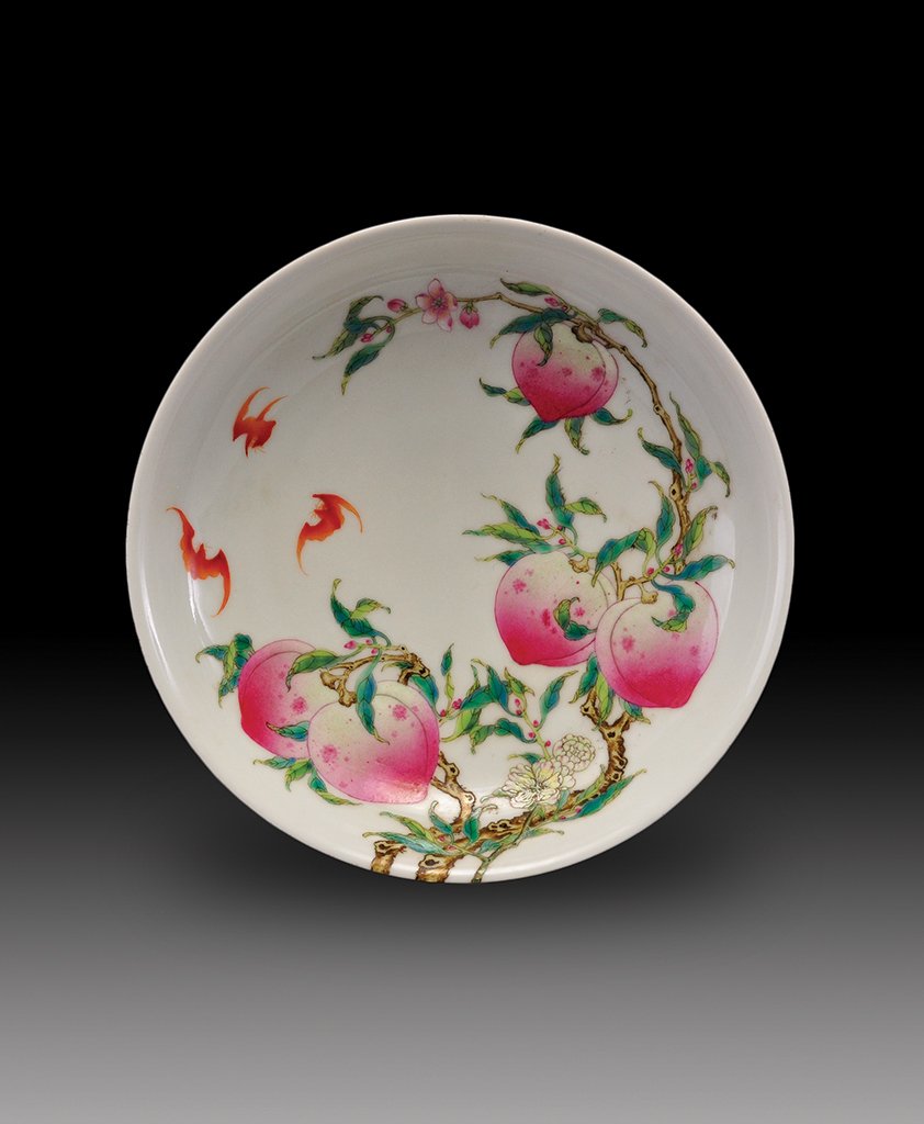 A FAMILLE-ROSE PEACH DISH: MARK OF QIANLONG The dish is overall decorate with many peaches and bats. 7 3/16 in. (18.2 cm) diameter, 1 5/8 in. (4.1 cm) tall.