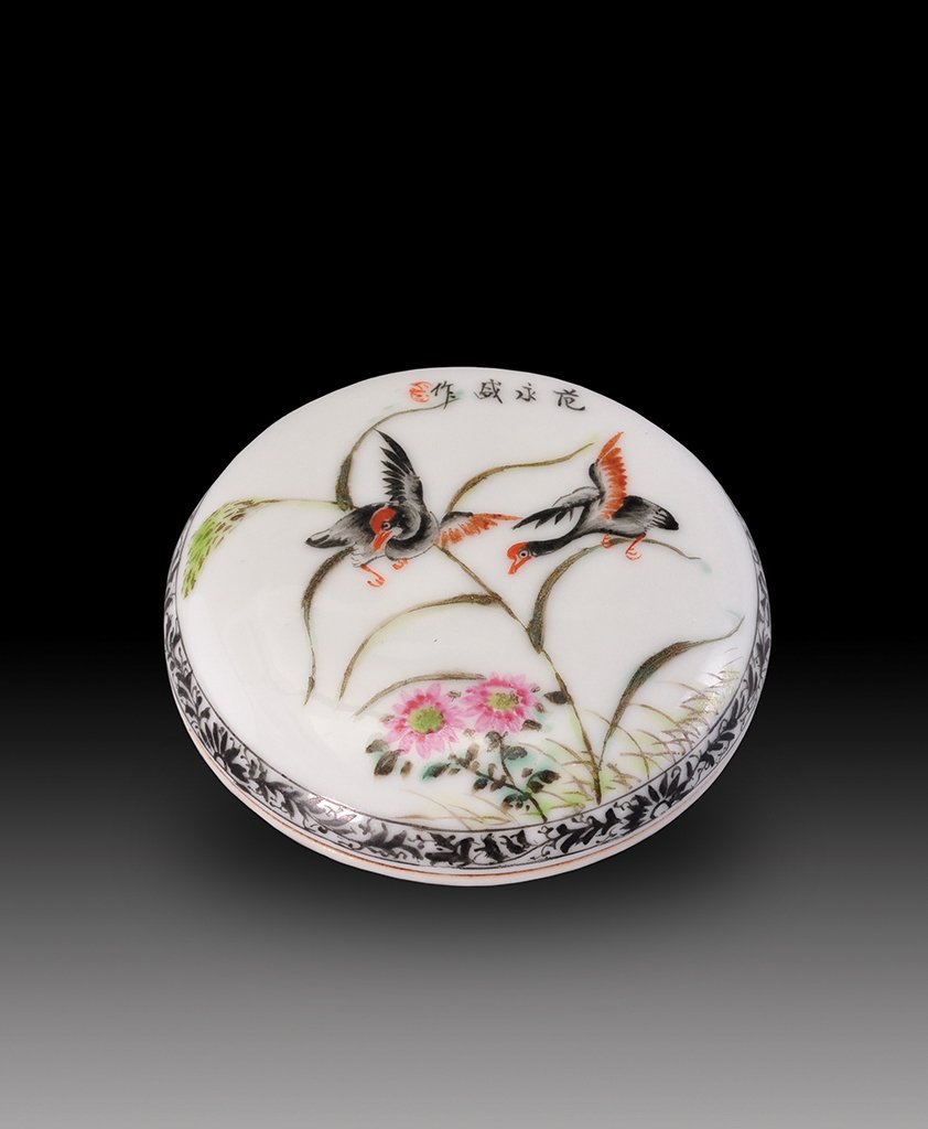 A FAMILLE-ROSE INKBOX AND COVER: EARLY 20th CENTURY The ink and cover is of circular- shaped and is decorate with many birds. 2 15/16 in. (7.5 cm) diameter. Box: 4 1/4 in. (10.8 cm), 4 1/4 in. (10.8 cm), 2 in. (5.1 cm).