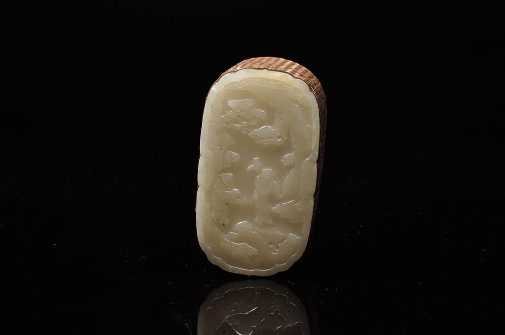 A WHITE JADE JEWELRY BOX: QING DYNASTY The jewelry box is of oval- shaped and exterior is decorate with a few scholars. 4 3/16 in. (10.6 cm), 2 3/8 in. (6 cm), 2 in. (5.2 cm).