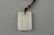 A CARVED WHITE JADE PENDANT