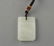 A CARVED WHITE JADE PENDANT - 2