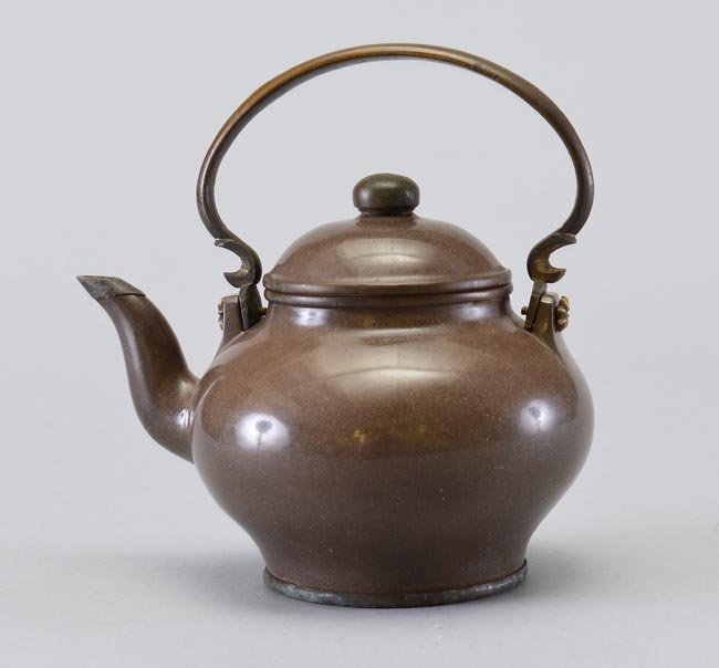A BRONZE TEAPOT AND COVER: 4 7/8 in. (12.4 cm) diameter.