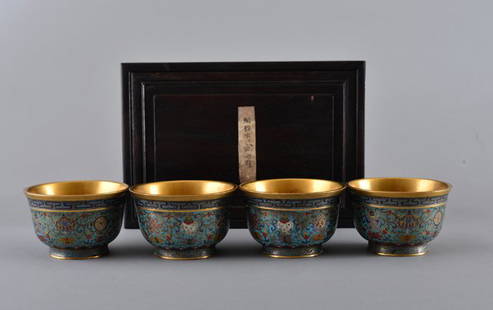 FOUR GILT-BRONZE CLOISNNE ENAMEL BOWLS AND BOX: QING DYNASTY The bowls floral design with a turquoise and royal blue background,with QianLong mark on base. 3 11/16 in. (9.4 cm) diameter.