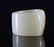 A CARVED WHITE AND RUSSET JADE 'POEM' ARCHER'S RING - 2