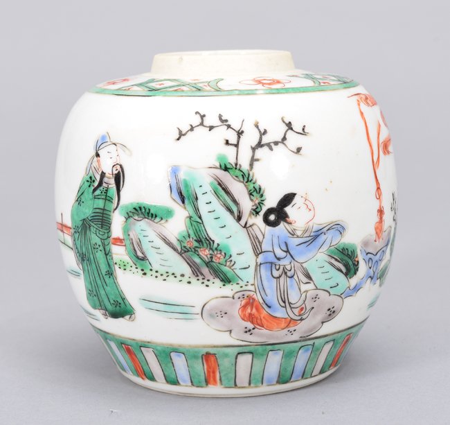 A WUCAI JAR: Period Of KangXi The jar is of wide globular-shaped and the exterior is decorated with a man and a woman enjoying the nature landscape. The interior is overall a white colour. 4 7/8 in. (12.4 cm) tall