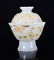 A GILTED WHITE JADE TEA BOWL AND COVER