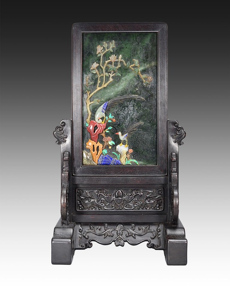 A SPINACH JADE WOOD SCREEN: Qing Dynasty the anterior of the table screen is decorated with a colorful birds in their natural habitats. The posterior of the table screen is decorated with numerous yellow color Chinese writings. 