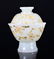 A GILTED WHITE JADE TEA BOWL AND COVER