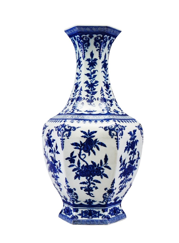 A LARGE OF BLUE AND WHITE VASE: The facetted sides finely painted with sprays of peach, pomegranate and persimmon, alternating with sprays of lotus, peony and chrysanthemum, all divided by upright and pendent floral scrolls at the c