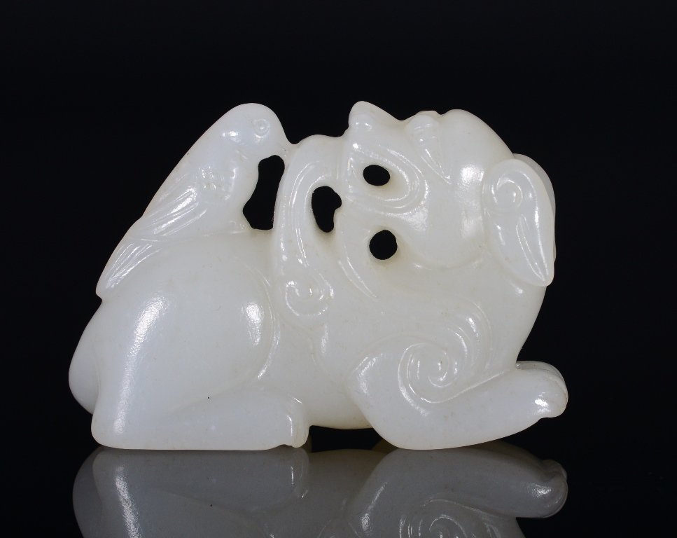A WHITE JADE CARVING OF LION AND BIRD (1 of 4)