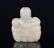 A CARVED WHITE JADE BOY'S PLAQUE