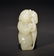 A WHITE JADE CARVING OF BOY
