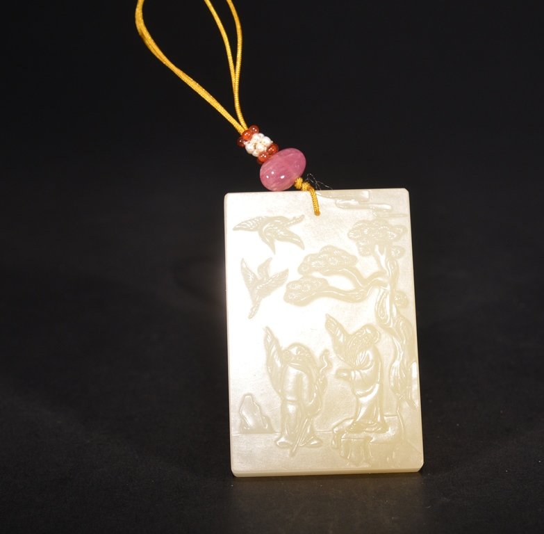 A CARVED WHITE JADE PLAQUE (1 of 4)