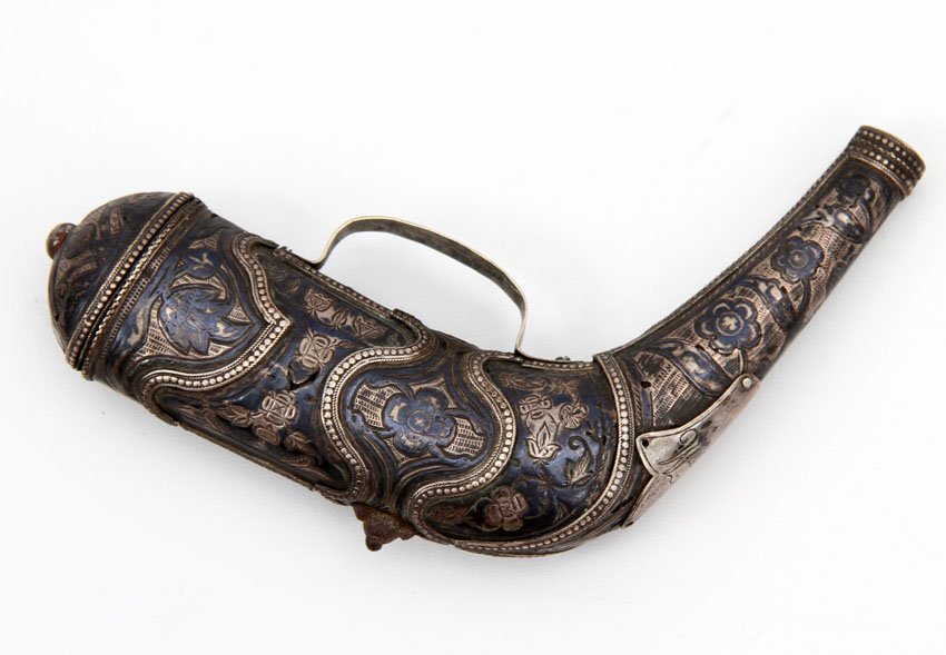 CAUCASIAN POWDER FLASK WITH NIELLO: Caucasian priming flask made of horn with beautiful silver mounts decorated with engraving and niello work. 19th century