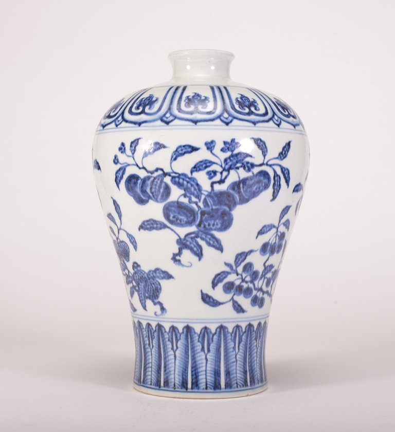 A BLUE AND WHITE MEIPING: The meiping vase is wide globular-shaped and the exterior is decorate with numerous flower blossoms. Ming Dynasty 11 7/8 in. (30.2 cm) tall.