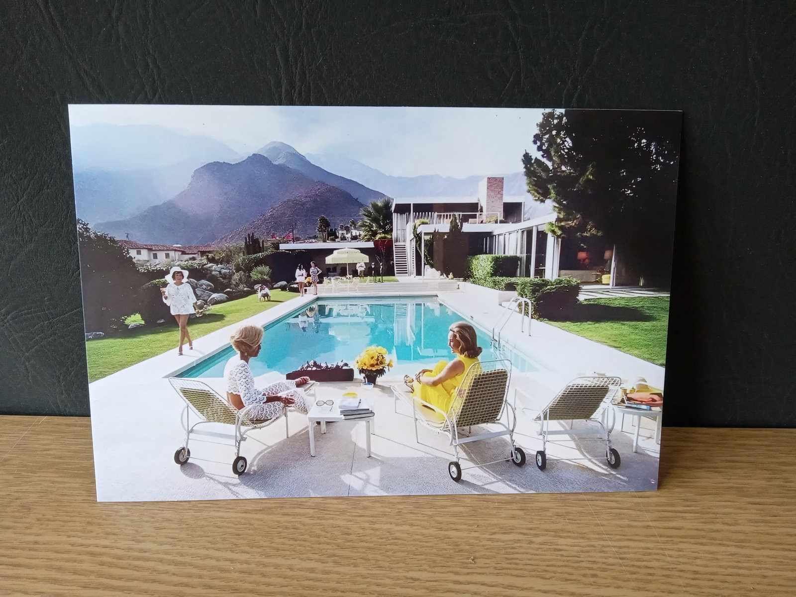 Slim Aarons "Poolside Gossip" Photo Print Sold After: Slim Aarons "Poolside Gossip" Photo Print - Measures 10 x 14 Inches. These items are part of an estate sale and we are a consignment based Auction House. All auction lots are sold strictly "AS IS."
