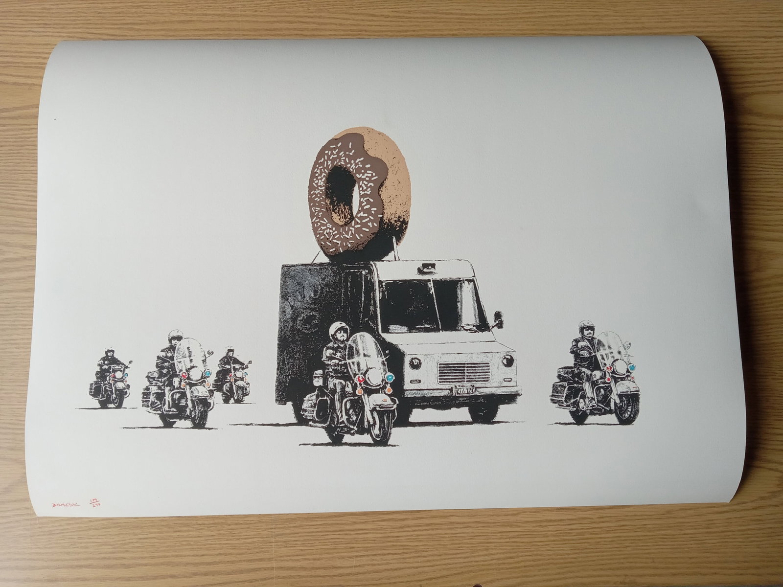Banksy "Donut" (Chocolate) Print Sold After: Banksy "Donut" (Chocolate) Print on heavy wove paper - Measures 21 7/8 X 29 7/8 Inches. These items are part of an estate sale and we are a consignment based Auction House. All auction lots are sold