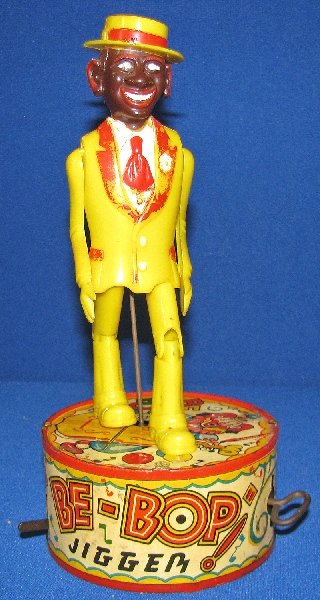 MARX BE-BOP JIGGER: Plastic Jigger on original tin base. Some paint wear to lapels on Jigger. Base has surface wear, minor spotting. Works fine. Size: 10" tall