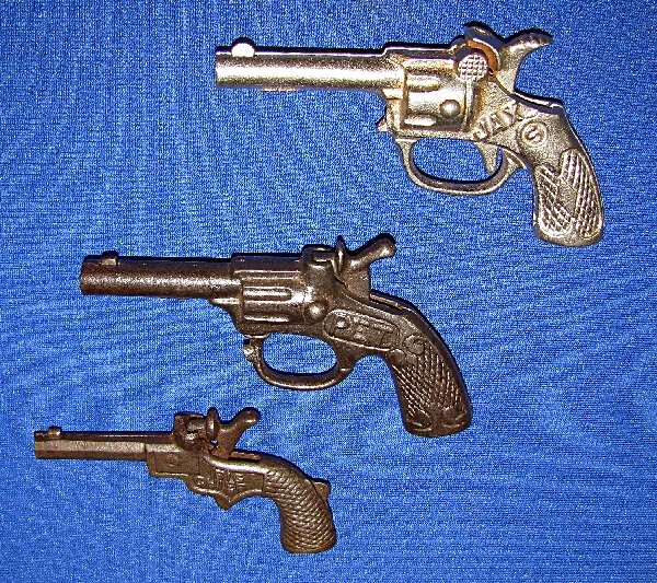 THREE CAST IRON SMALL SINGLE SHOT CAP GUNS