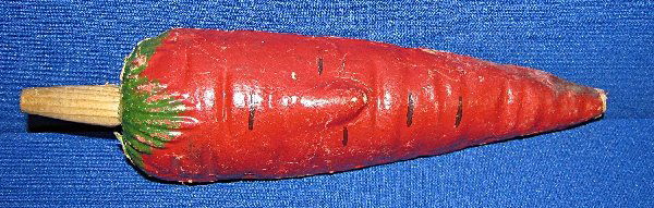 FIGURAL PRESSED PAPER HORN: Carrot, paint crazing and rubs, some minor damage to tip. The reed is loose inside so not working. German. Hand painted Size: 8.25" long x 2.25" tall