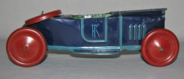 UNUSUAL TIN LITHO BOATTAIL SPEEDSTER: C-1930 tin litho push toy car made by Kiddies Metal Toys, Inc., Eliz., N.J. First we have seen of this toy. There is some minor bending to tin body. The seat and the rear deck have some litho wear and