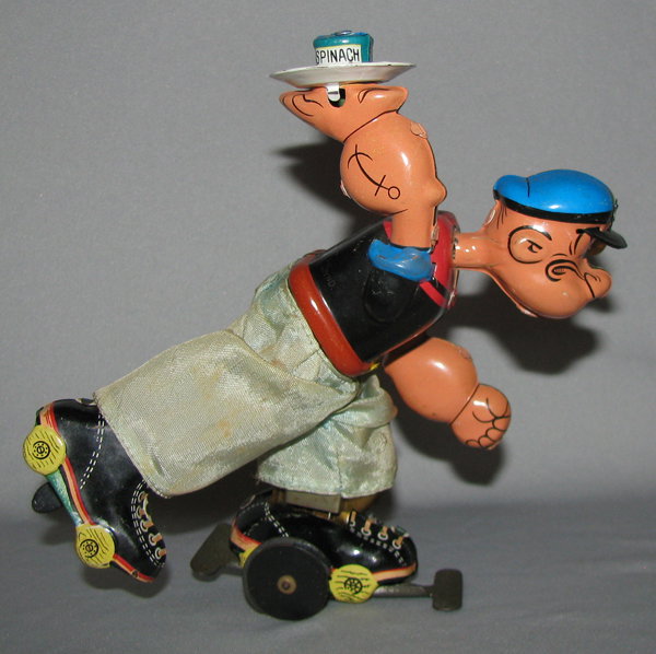LINEMAR POPEYE ROLLER SKATER: Complete. Toy works fine. Outer wheel has some chips to rubber. Original pants have some soiling. Some scattered light scratching. Size: 6" tall