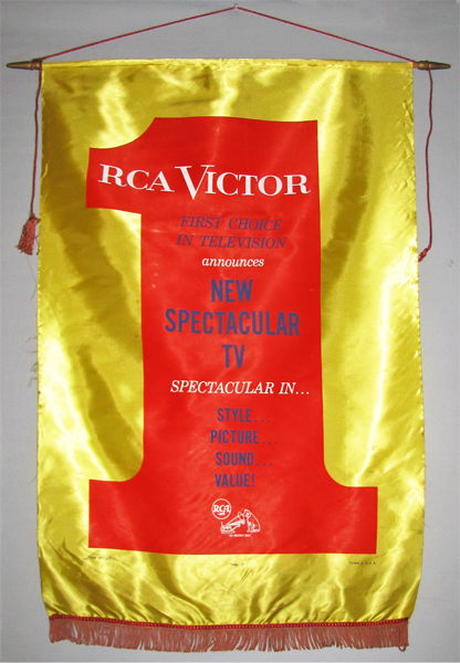 C-1950 SATIN BANNER FOR RCA VICTOR TELEVISIONS: Yellow and red banner has original cloth tassels and original hanging rod. Has some edge wear and minor staining. Size: 42" long x 33" wide