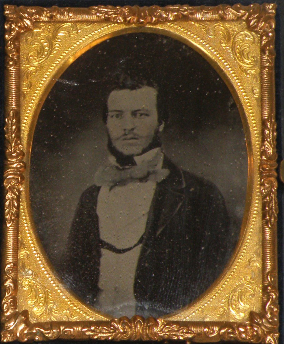 CASED 1/9 PLATE AMBROTYPE OF A WELL DRESSED MAN: Image is crisp and well detailed, image is in a Littlefield, Parsons & Co., Union Case, case has a couple of tiny corner nicks, case grades very fine to excellent.