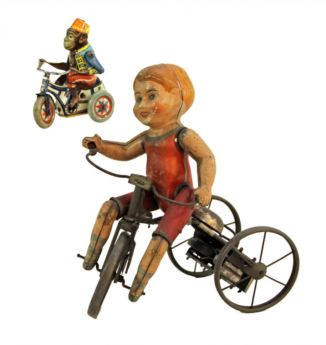 TWO TIN WIND UP TRICYCLE TOYS: Arnold Boby made in US Zone Germany, works sporadically, and a Marx tin litho boy on tricycle, works fine, both show play wear. Size: Largest is 8 inches long, 9 inches tall