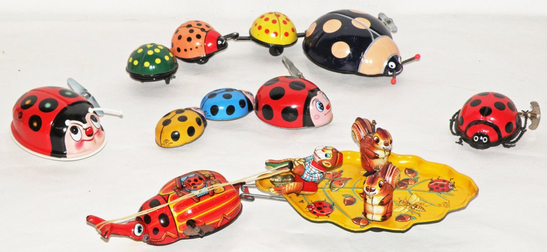 FIVE WIND UP JAPANESE TOY BEETLES: Including TPS Wagon Fantasy Land, TPS ladybugs and other Japanese ladybugs. Light wear. Size: Largest: 11 1/2" long