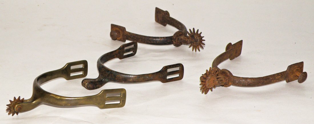 FOUR 19TH CENTURY SPURS: Includes Military style. One spur missing rowel. Size: 4 1/2" long