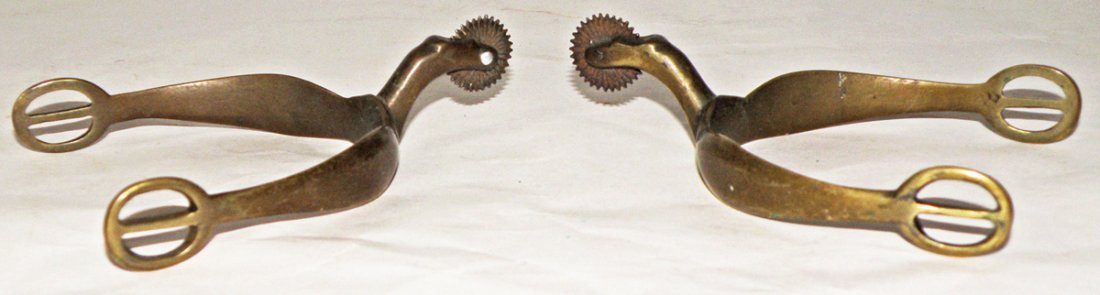 PAIR OF CIVIL WAR ERA SPURS: Nicely made spurs. Possibly for an officer. One rowel pin replaced. Size: 5 1/4" long