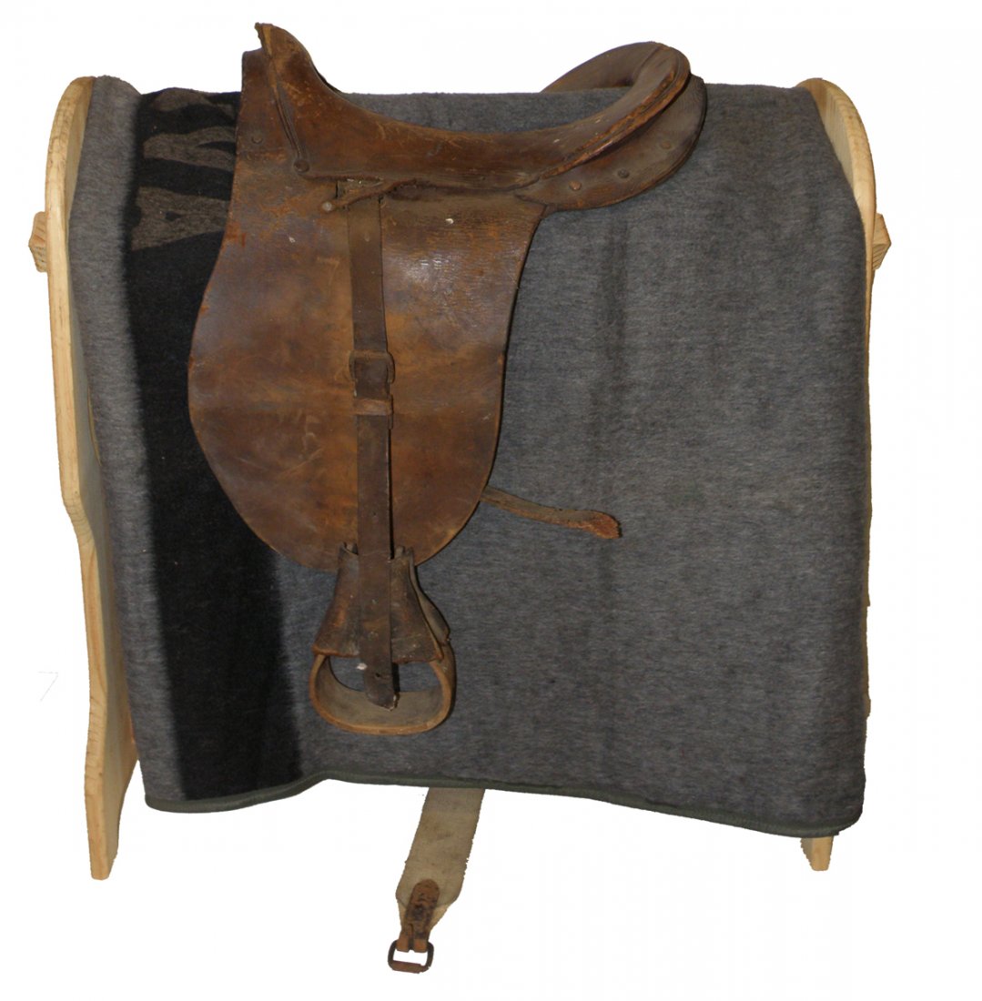 SPAN-AM WAR ERA MCCLELLAN SADDLE: Complete with girth strap and stirrups. Shows age and use wear. Size: 18" long