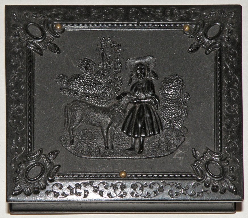 1/9 PLATE RUBY DAUGUERROTYPE OF ROSA F. GEORGE: Rosa George was a relative of Gustavus B. Williams. In excellent thermo plastic Union case depicting Mary and her lamb. Image missing framing.