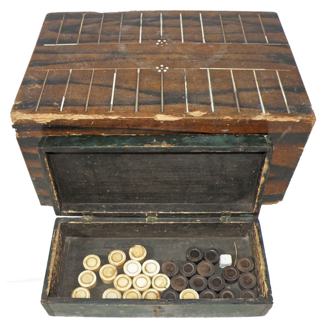 CIVIL WAR ERA HANDMADE BACKGAMMON BOARD: Unusual heavy duty Backgammon board that has been hand carved from one hunk of wood. Board has carved handle and inlaid bone playing surface. Backgammon pieces are carved bone and ebonized wood. There