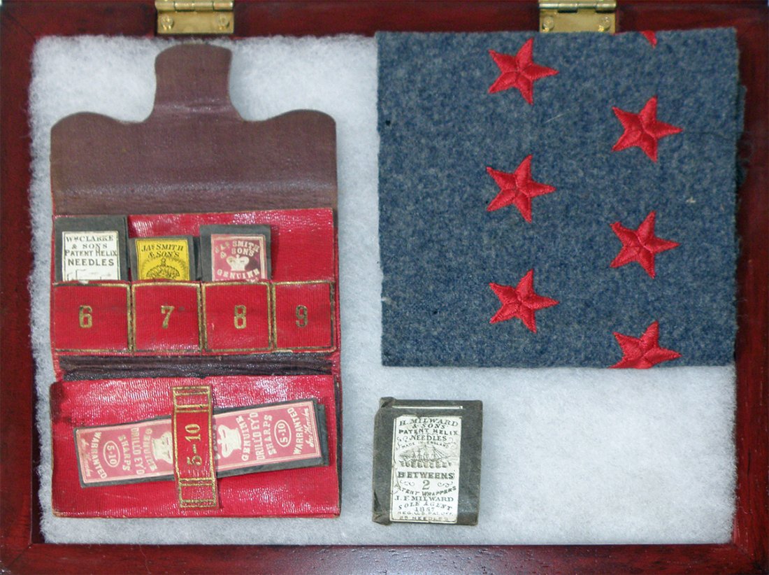 CIVIL WAR ERA HOUSEWIFE AND SWATCH OF CONFEDERATE : Housewife made by S.T. & Sons. Missing one needle book. Cloth is Augusta Arsenal artillery rank insignia and comes with provenance. Some mothing to cloth. Size: Largest: 15" X 4 1/2"