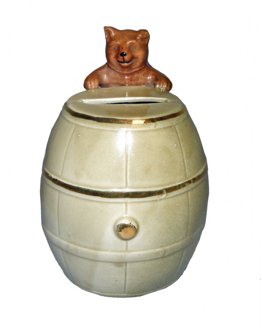 BEAR WITH BARREL PORCELAIN STILL BANK: Made in Germany C-1920. Ref. One Hundred Years of Ceramic Money Banks, by Beth Baddeley Huebner, Vol. 1, Plate 31, Rarity D. Size: 4-1/8" tall