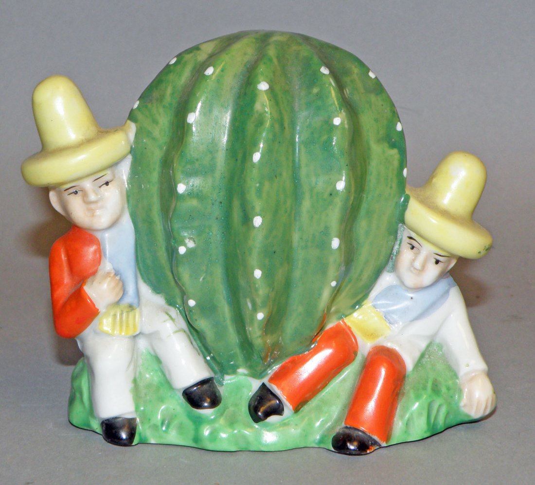 TWO MEXICANS WITH CACTUS CERAMIC STILL BANK: Colorful Japanese bank C-1935. Ref. One Hundred Years of Ceramic Money Banks, by Beth Baddeley Huebner, Vol. 3, Plate 290, Rarity A. Size: 4" tall, 4-3/4" long