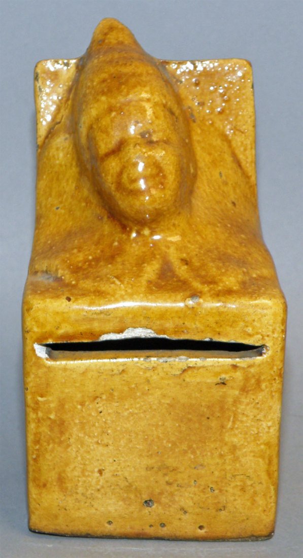 JACK IN THE BOX EARTHENWARE STILL BANK: Austrian C-1900, incised number 2302 on bottom, small chip at coin slot. Ref. Penny Banks Around The World, by Don Duer, Plate 349, Rarity B. Size: 4-3/4" tall, 2-3/8" wide